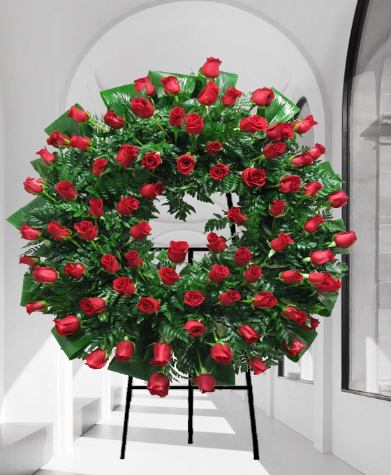 Corona funeraria con rosas rojas